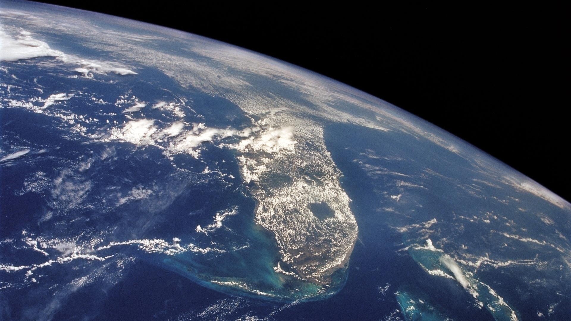 slide 1 - Communities in coastal areas such as Florida, shown in this 1992 NASA image, are vulnerable to the effects of sea level rise, including high-tide flooding. A new agency-led analysis found a higher-than-expected rate of sea level rise in 2024, which was also the hottest year on record. NASA