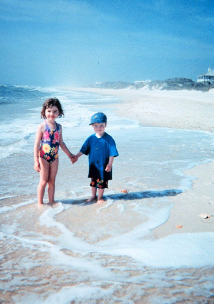 kids walking along the beach