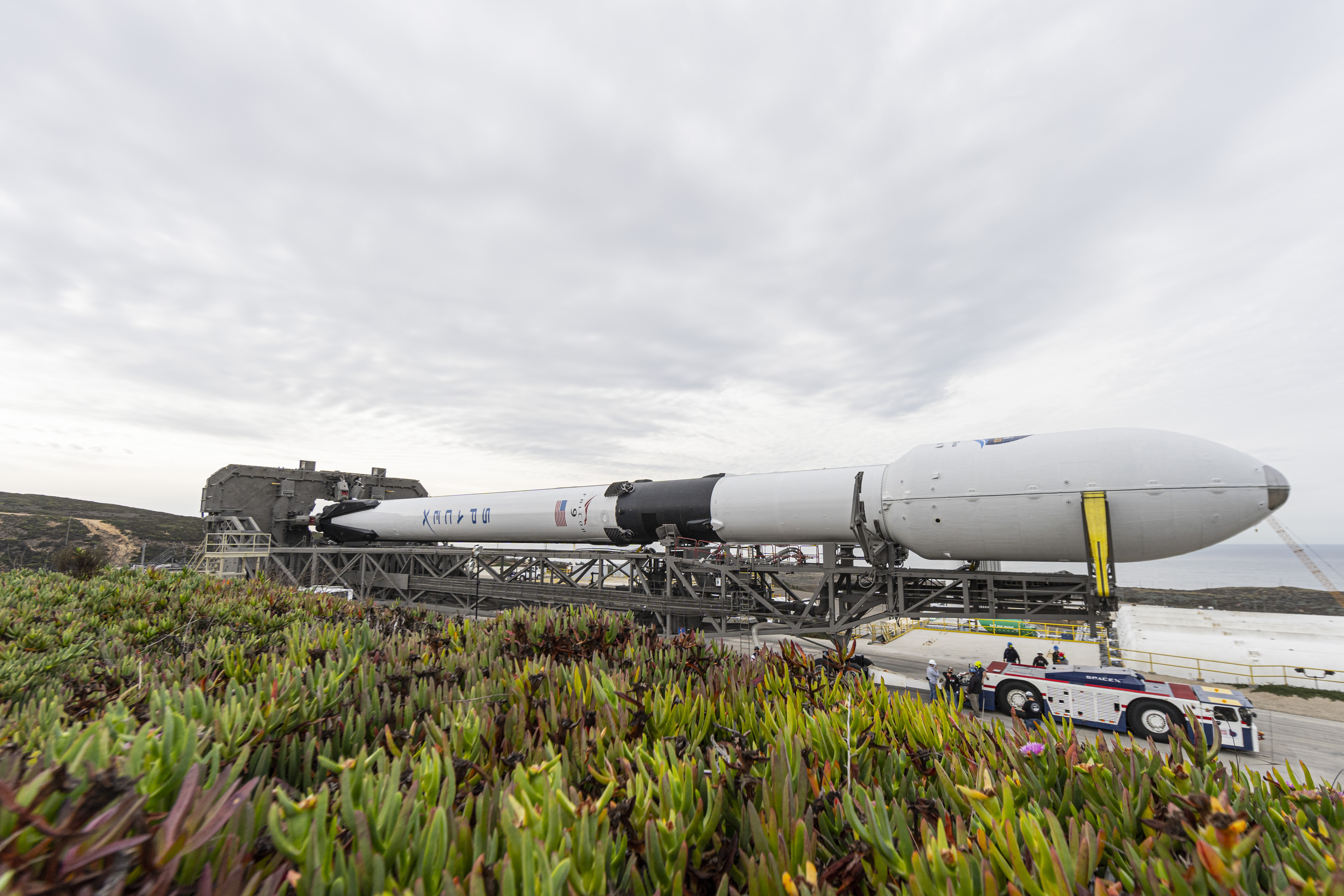 Falcon 9 rolls to pad