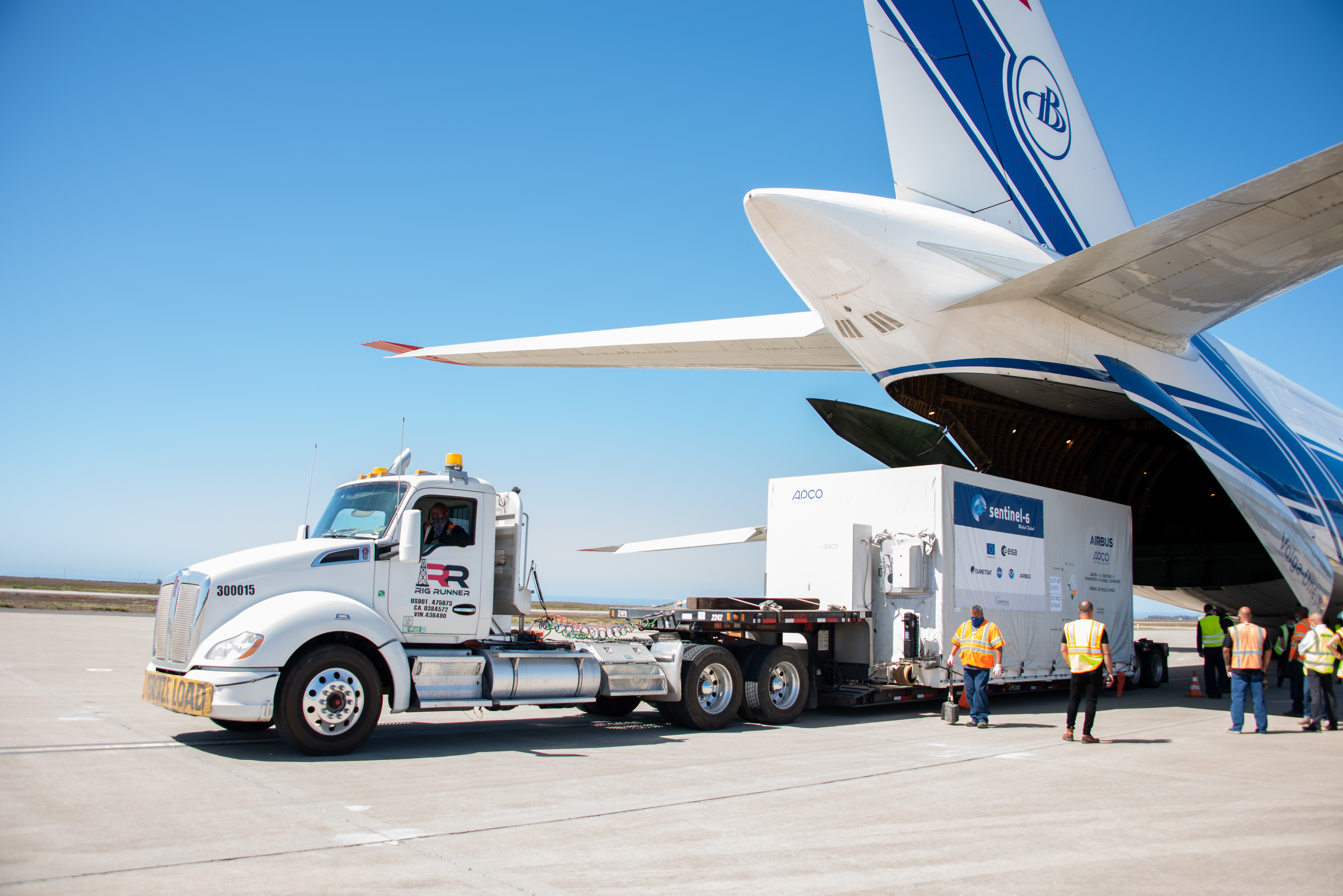 A photo of Sentinel-6 Michael Freilich attached to a truck to be driven away.