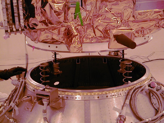 These photos were taken during the Dual Payload Attach Fitting (DPAF) mating operation with Jason-1. (11/13/01) Photos: Scott Michel